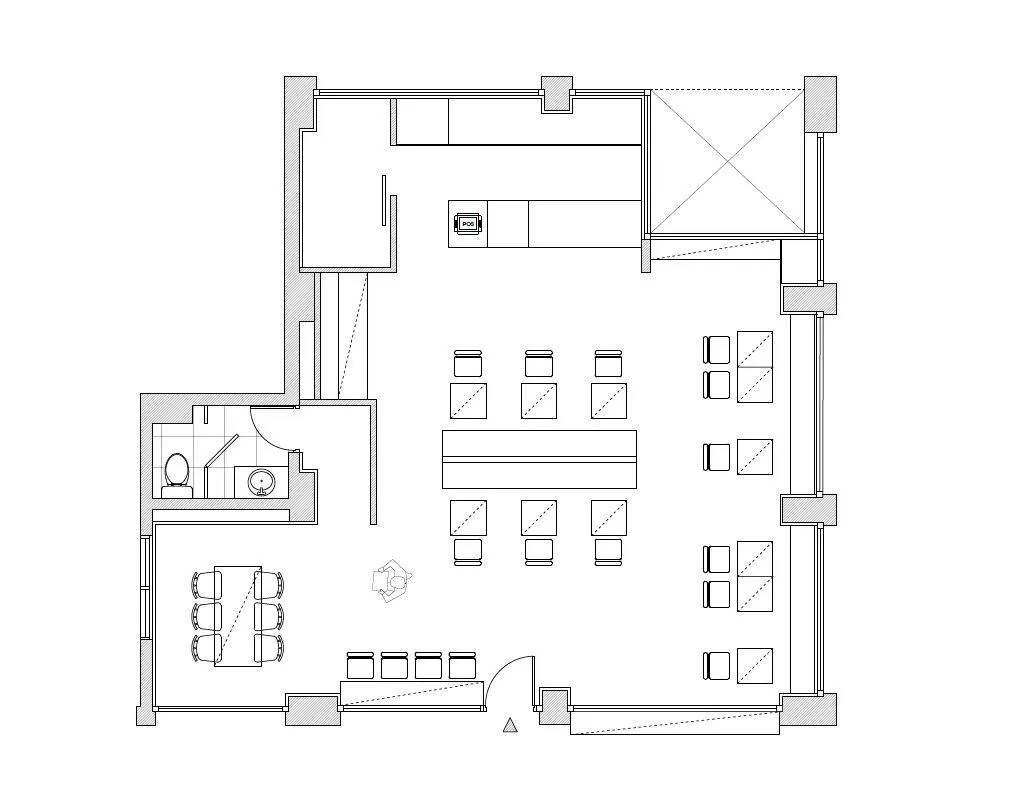 Floor plan of an office space with neutral color palette, including desks, cubicles, and conference room