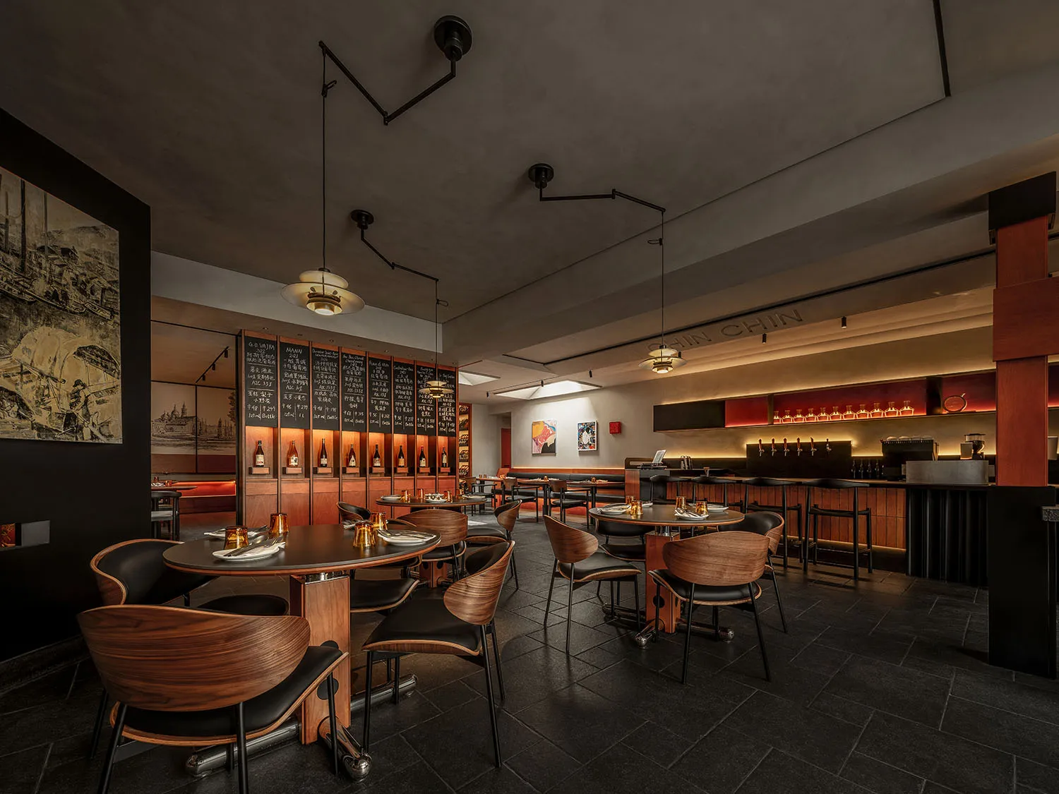 Modern restaurant interior featuring wood, leather, metal, and glass materials.