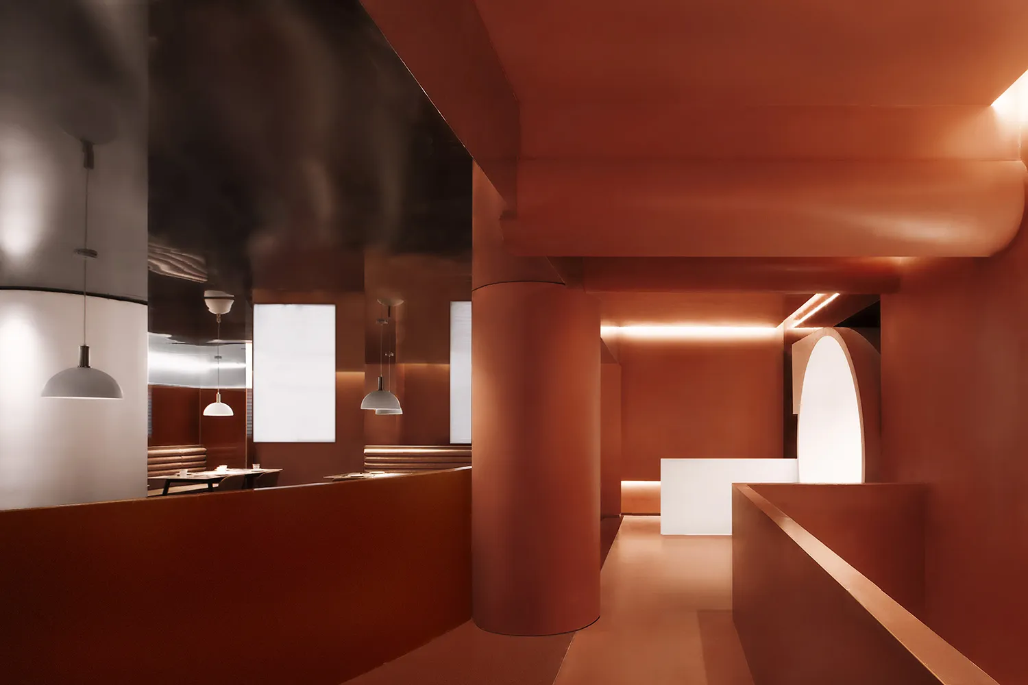 Modern restaurant interior with exposed concrete walls and white pendant lights.