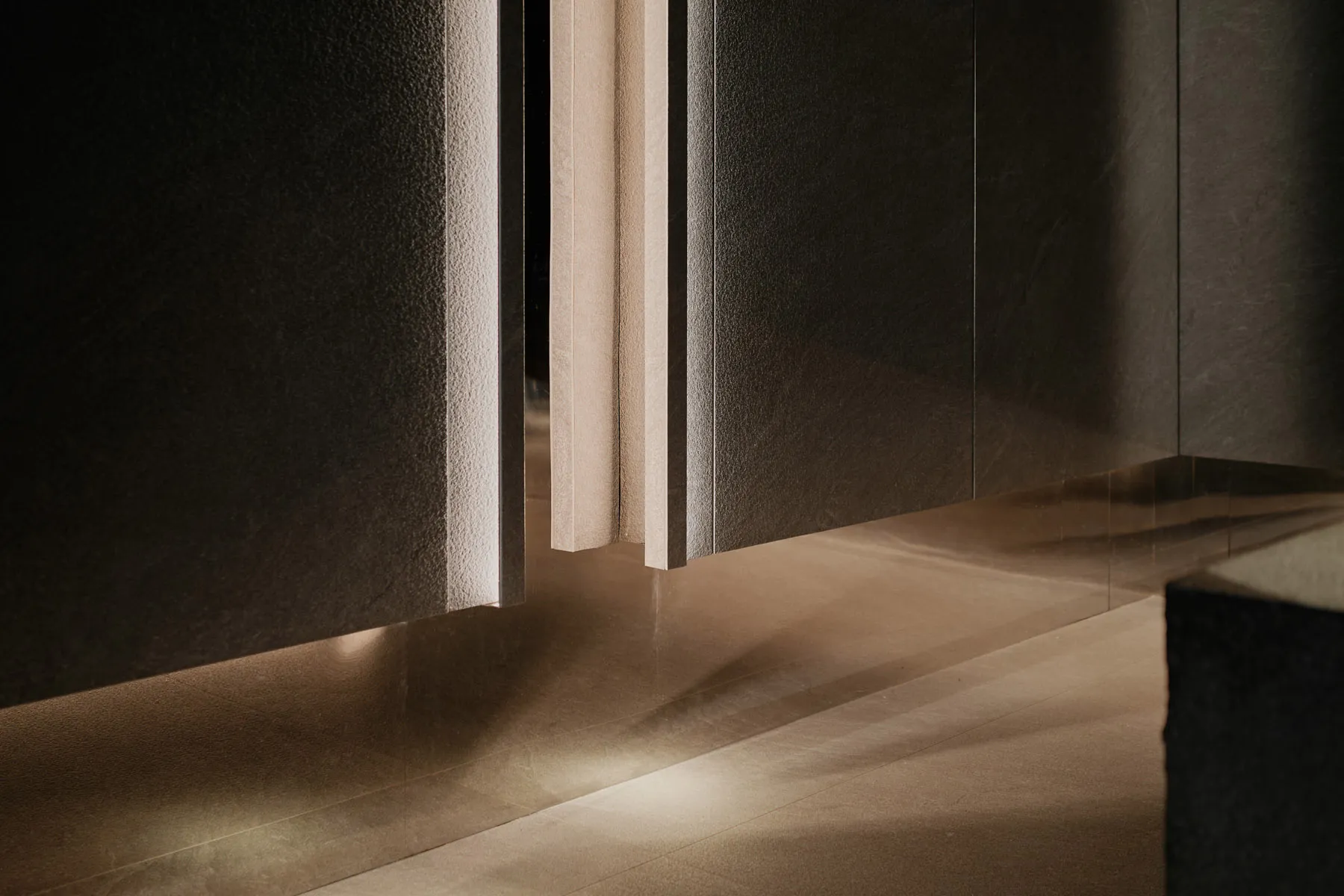 Modern minimalist interior design featuring a combination of black and white metallic materials.