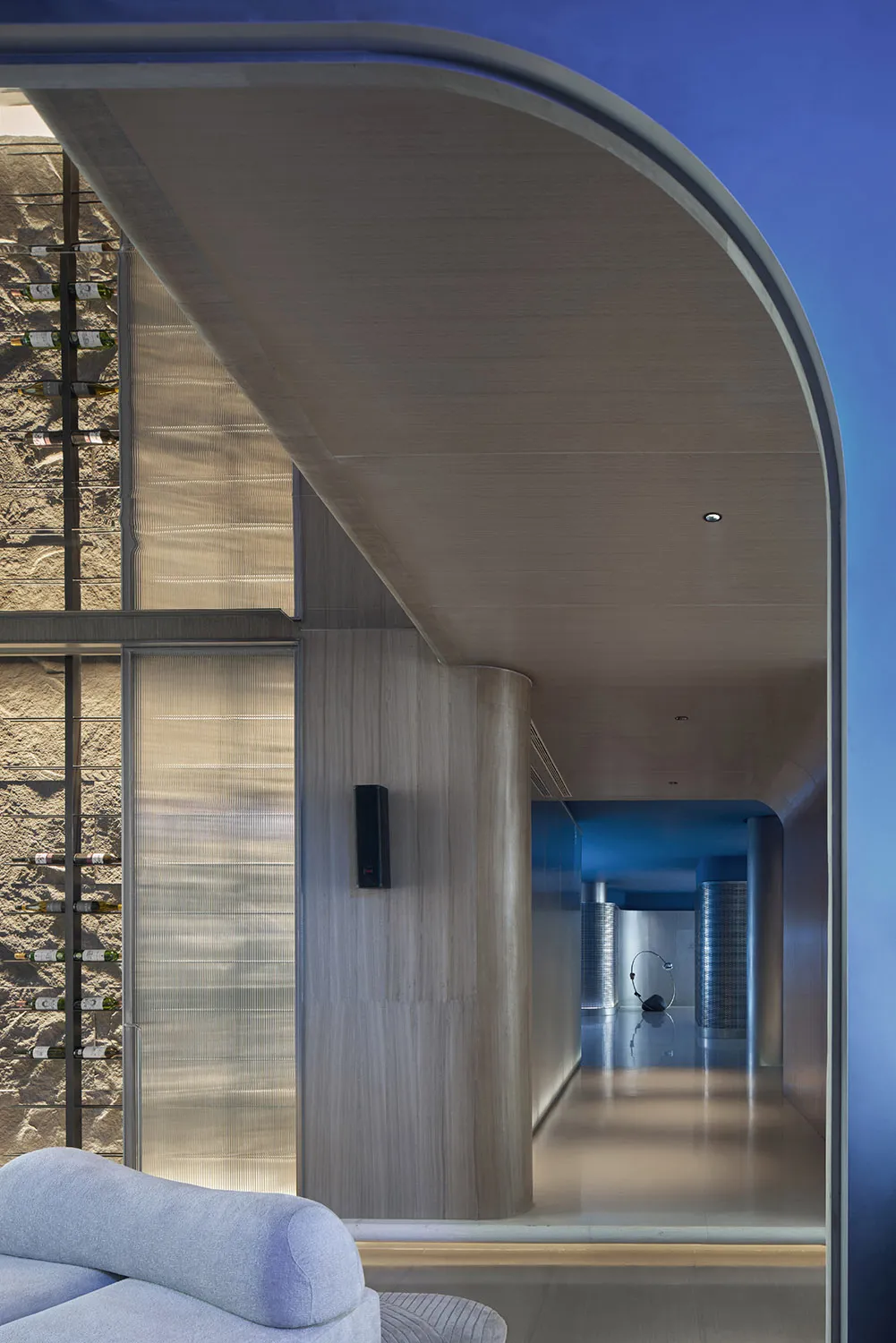 Modern residential interior featuring glass and wood materials.
