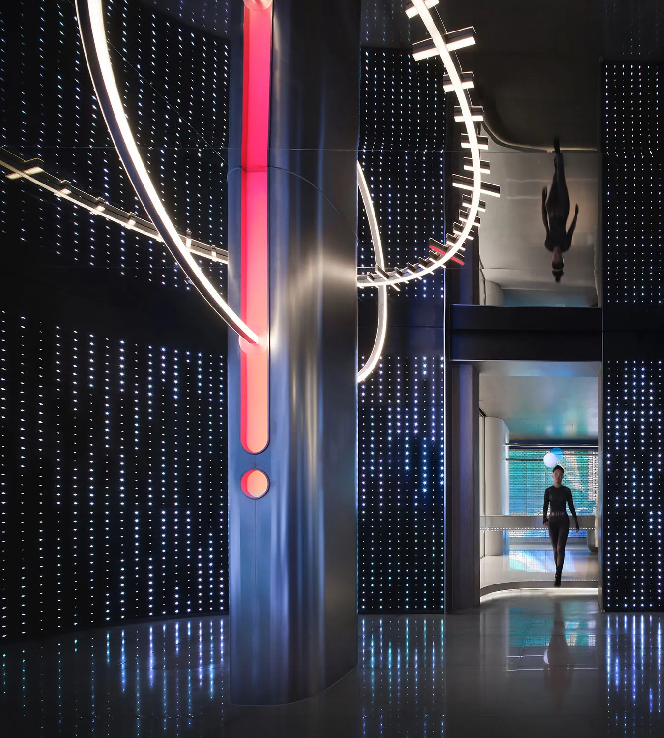 A modern interior design featuring metallic structures and illuminated LED lights.