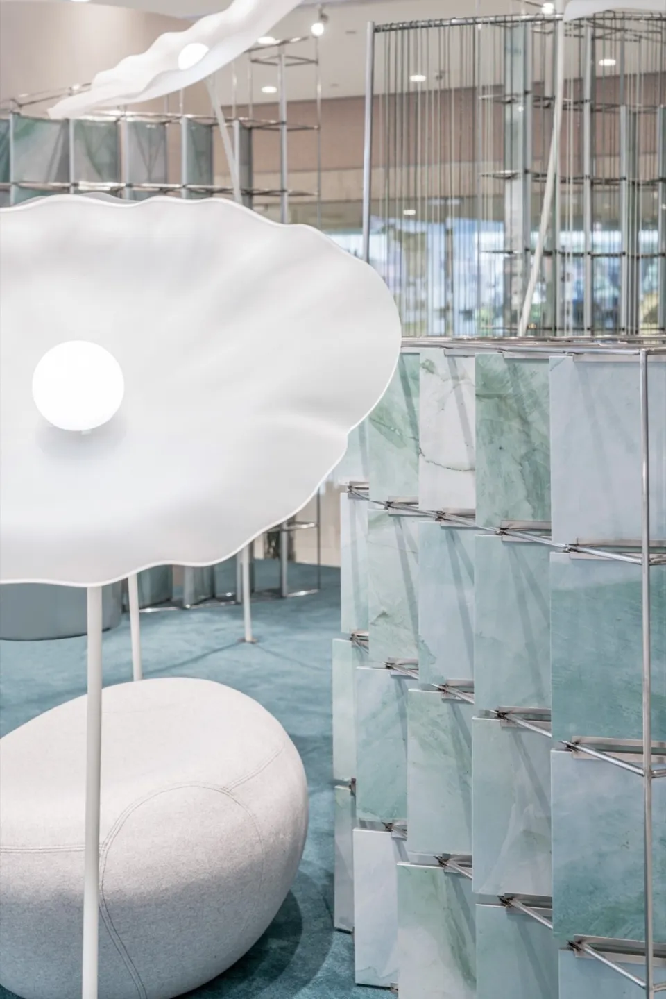 Modern retail shop interior featuring glass, marble, and metal materials