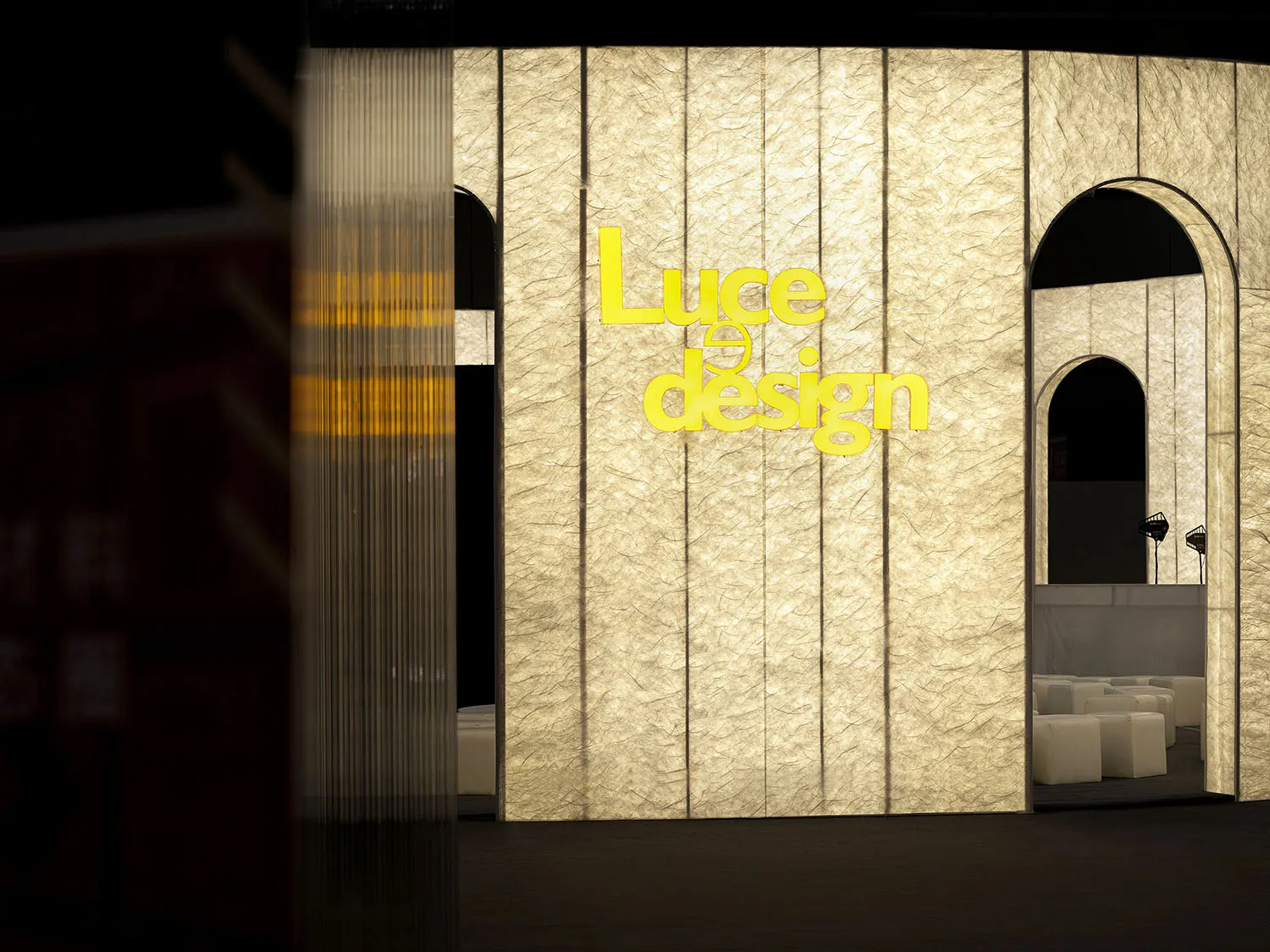 A textured paper facade with the words "Luce Design" on it.