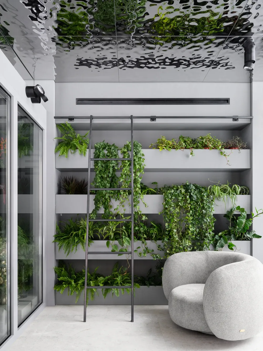 A modern residential interior with glass walls, concrete floors, and timber accents.