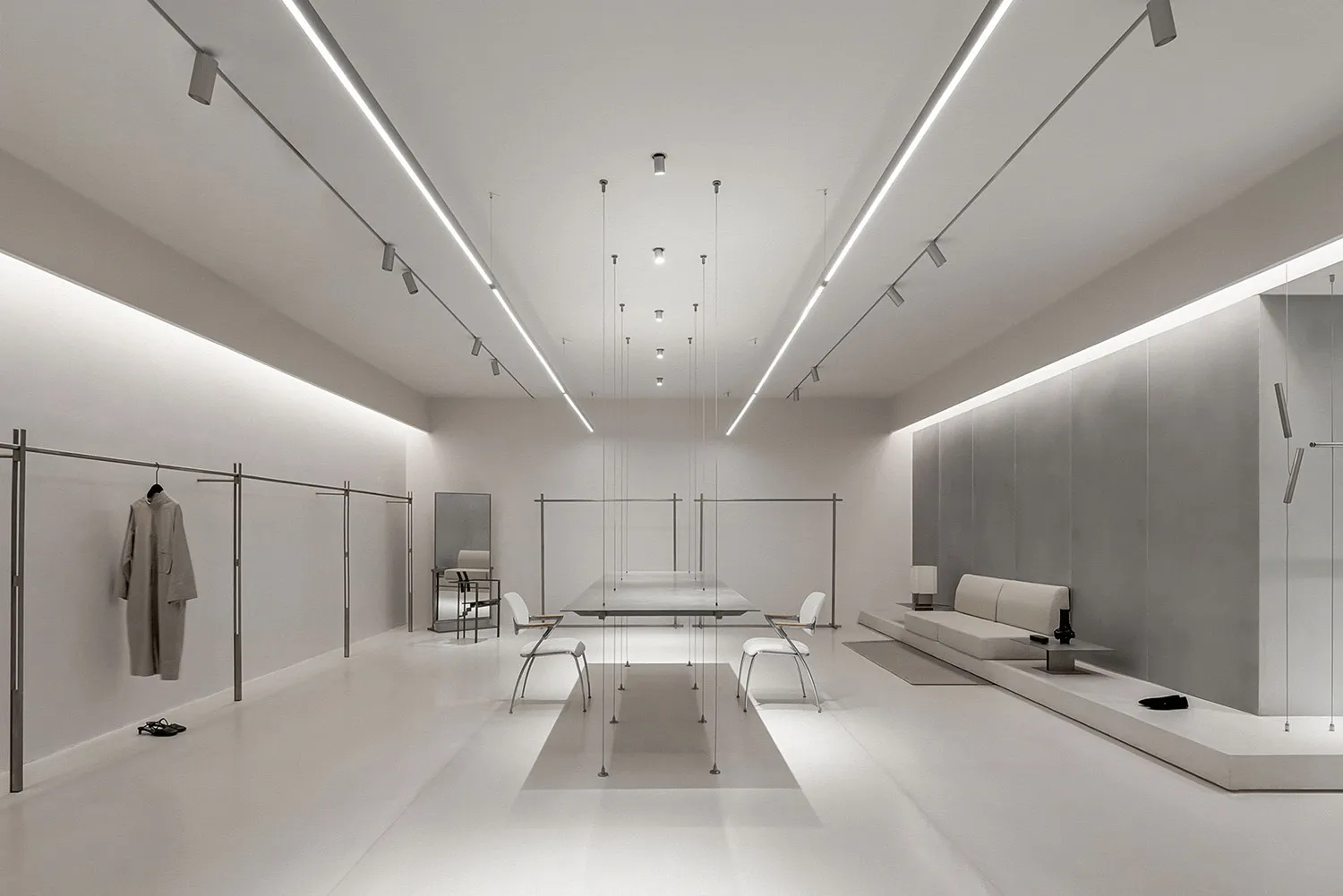 Modern minimalist retail store featuring metal, glass, and white materials