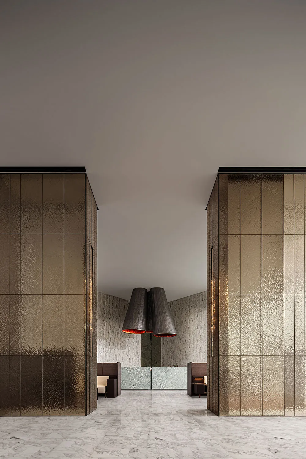 A modern lobby with metallic tiles and marble flooring.