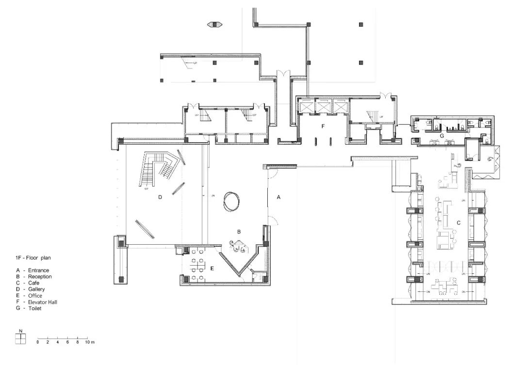 A detailed architectural floor plan of a modern office space featuring concrete and metallic materials.