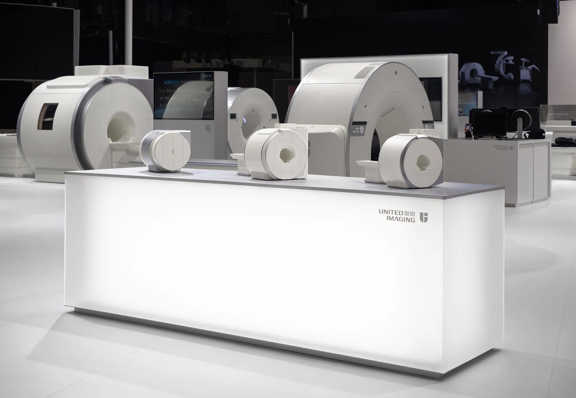 United Imaging's white medical devices on display at an exhibition.