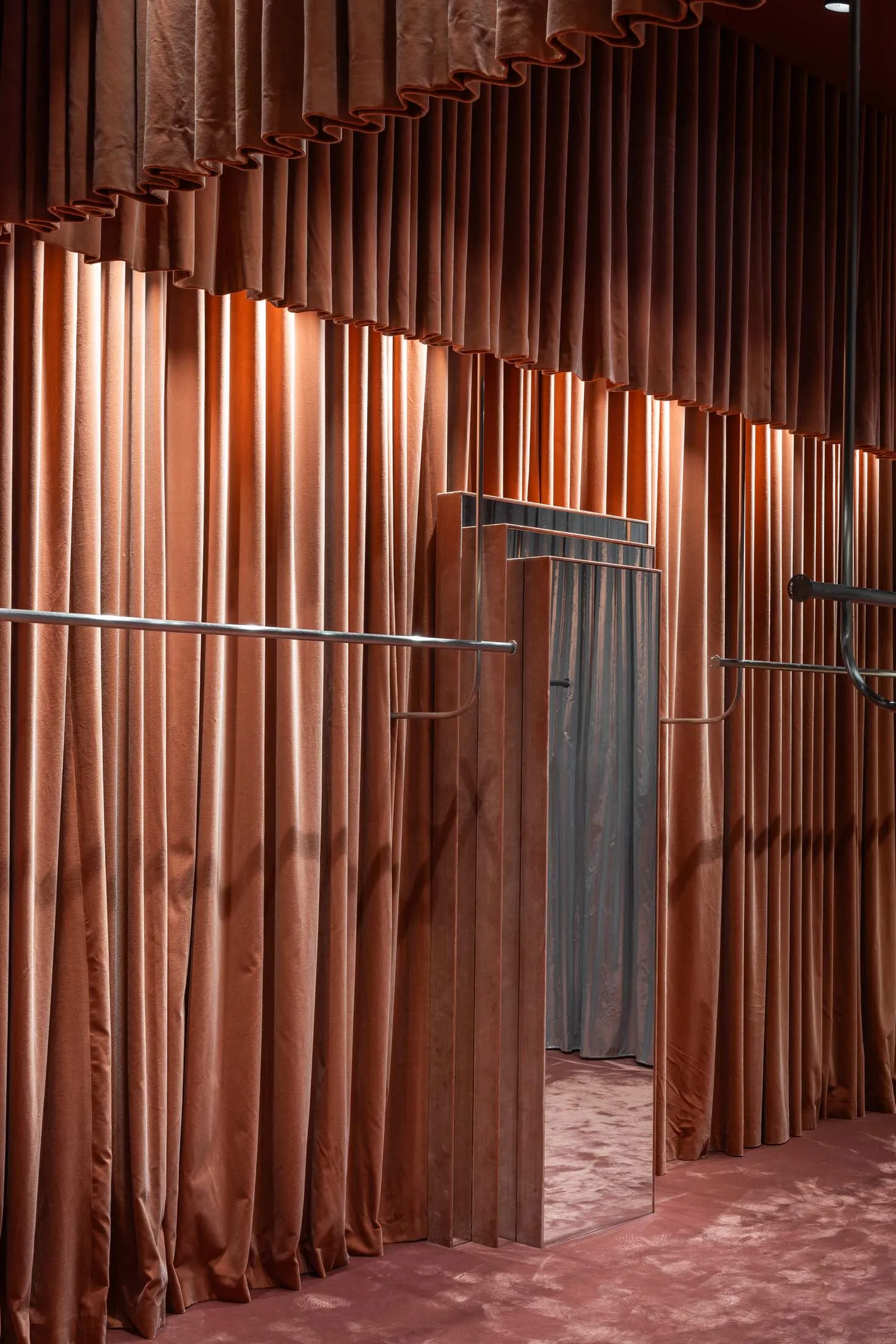 A clothing store with a velvety interior design.