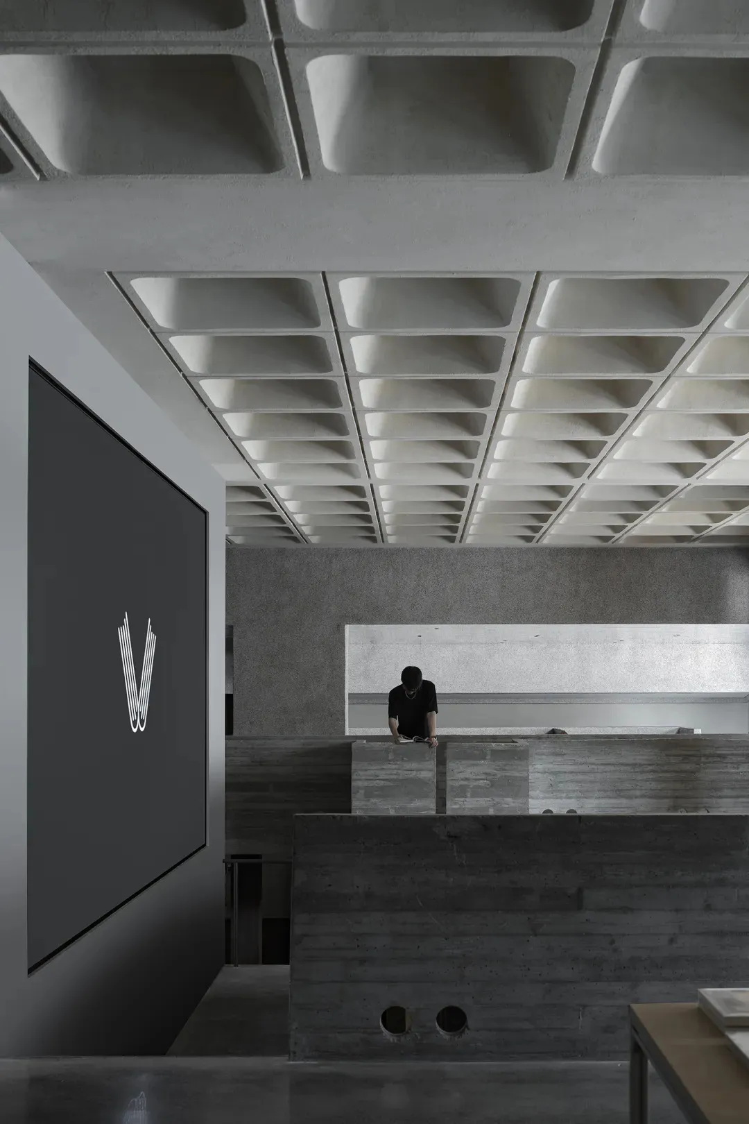 Modern interior design featuring concrete materials and minimalist aesthetic