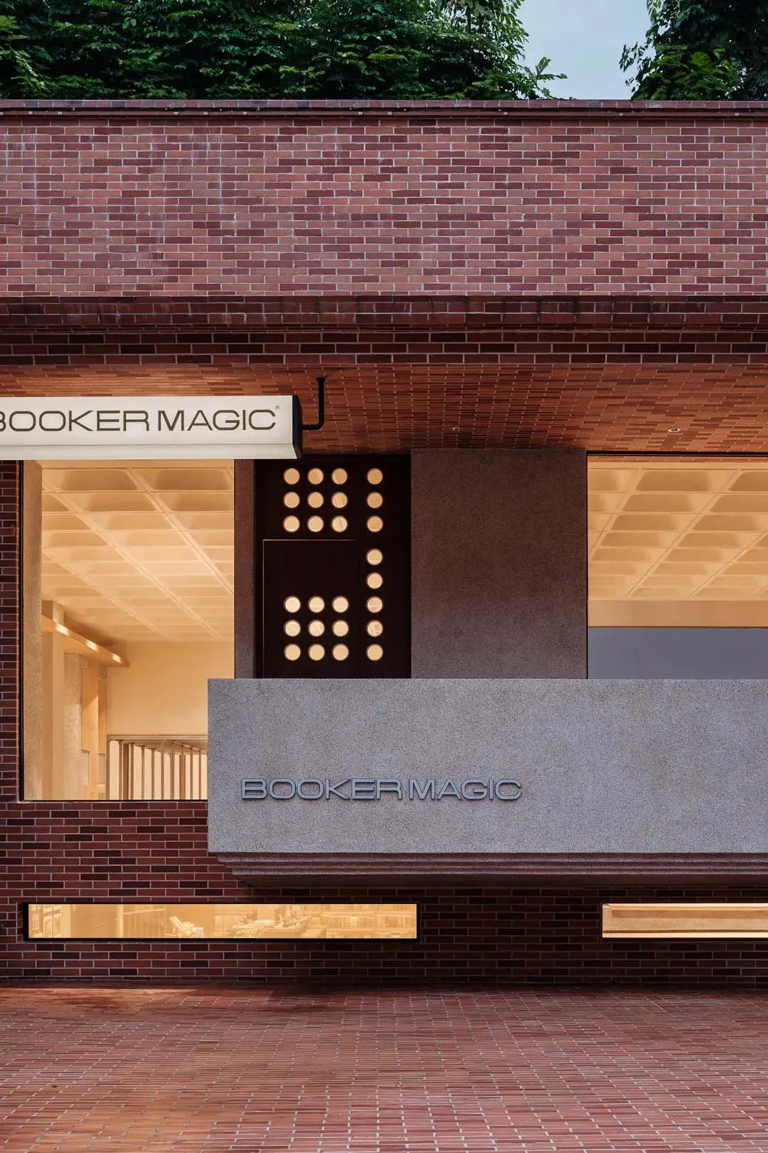Modern retail storefront with brick facade and glass windows