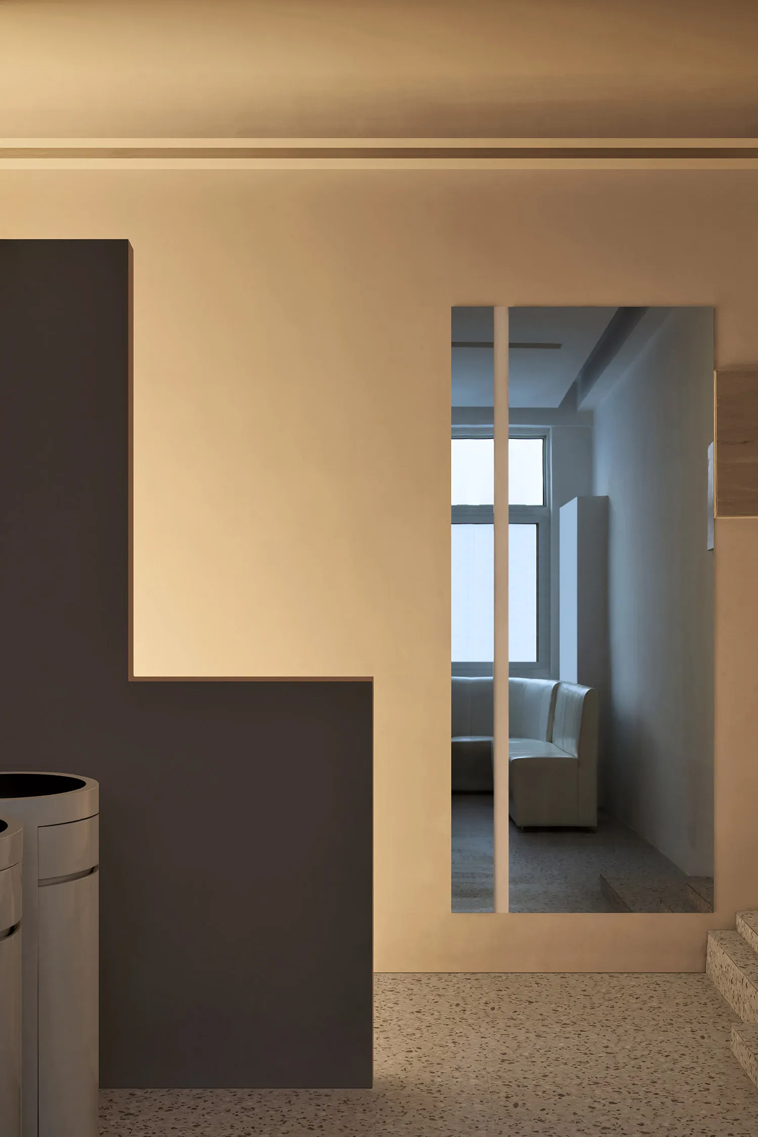Modern minimalist interior with concrete walls and floor.