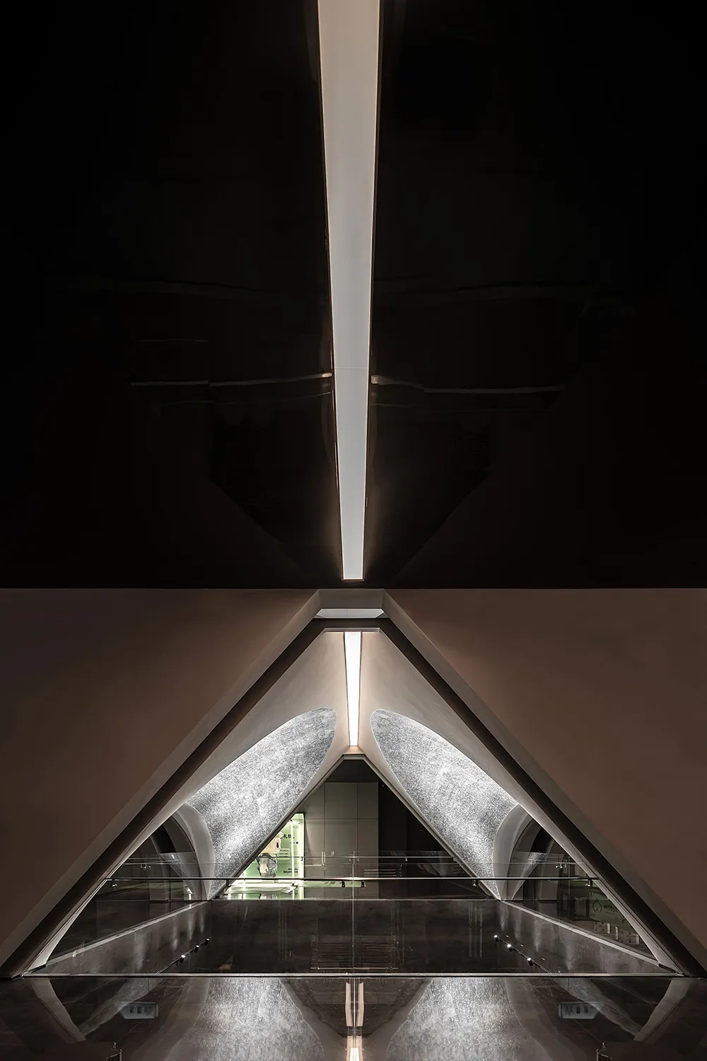 A sleek, modern interior design featuring glass walls and concrete elements.