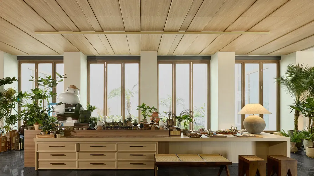 A minimalist living room featuring wooden furniture and decor.