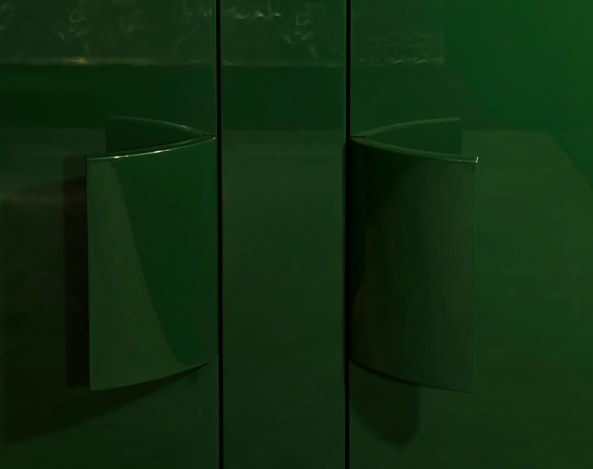 A modern interior design featuring green metal elements.