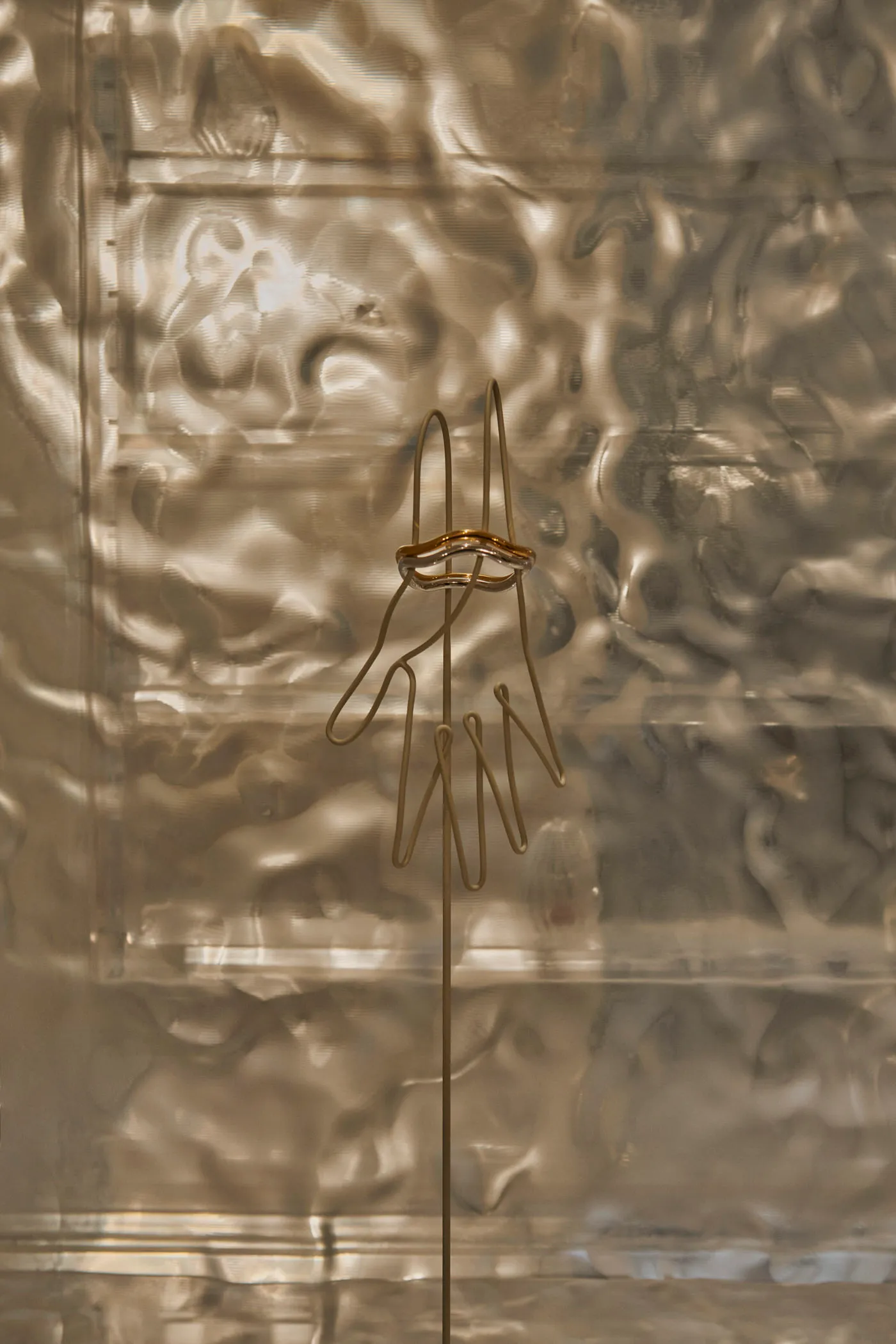 A contemporary metal sculpture with an abstract design.