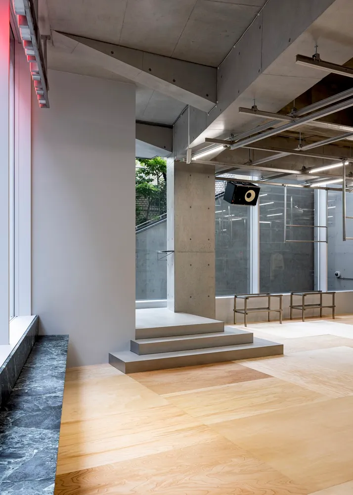 A minimalist interior design with concrete materials and a modern aesthetic.