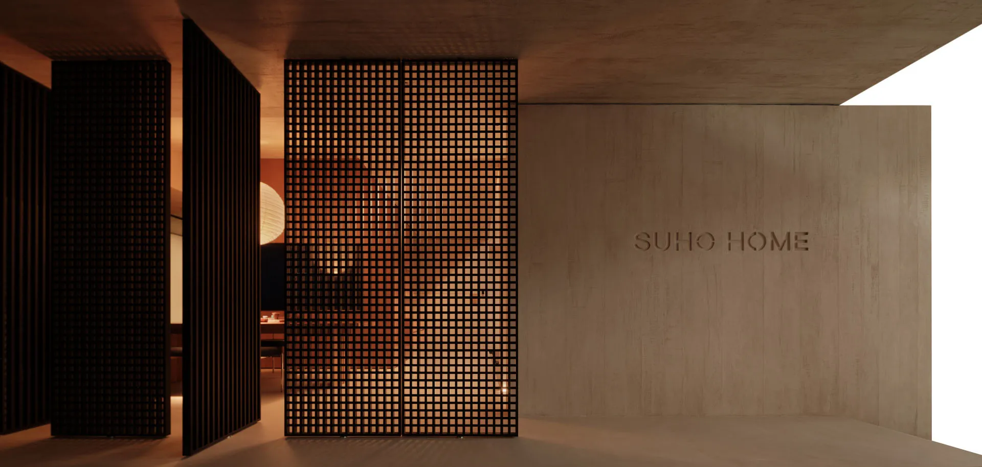 A modern lobby features a textured concrete wall with a grid of lights, providing an inviting and stylish atmosphere.