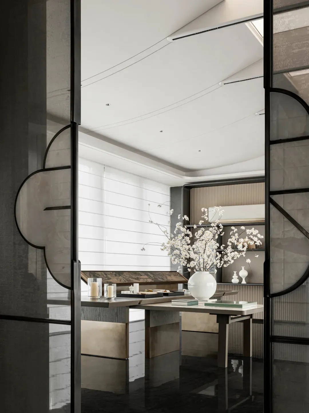 Modern minimalist living room featuring a white marble table with a white vase and book, black marble floor, and white wooden