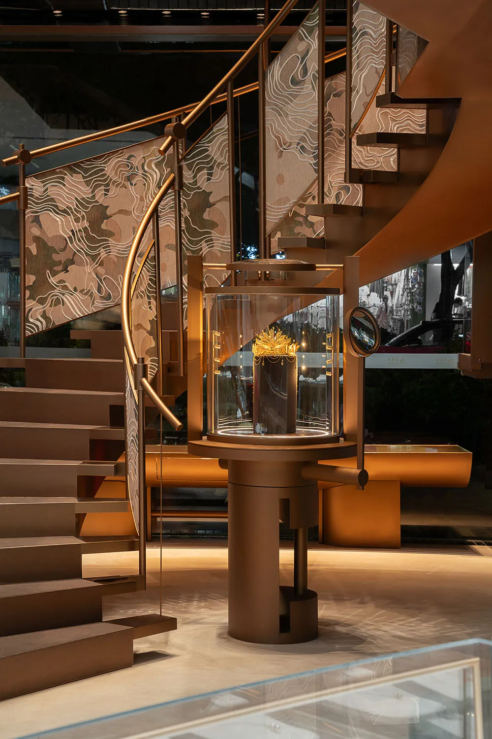 Modern retail shop featuring metal railings and a glass display case.