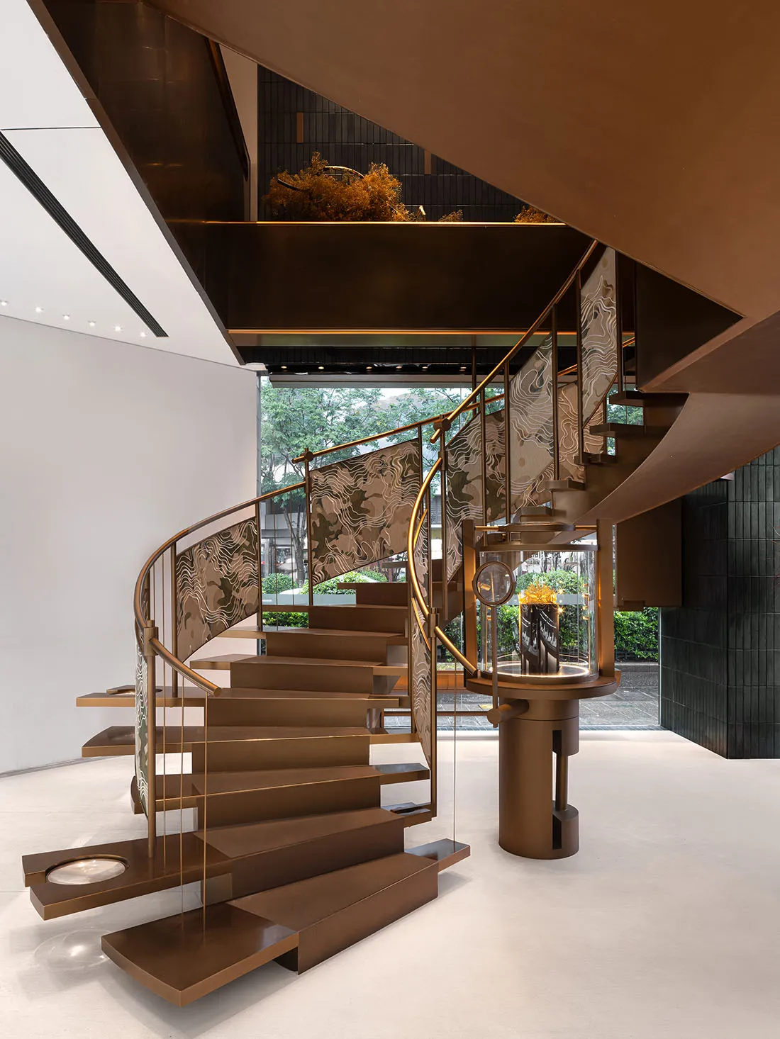 Modern staircase with metal railings and steps, featuring a contemporary design.