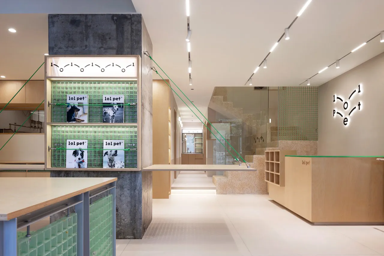 Retail storefront interior design featuring modern materials like concrete and glass