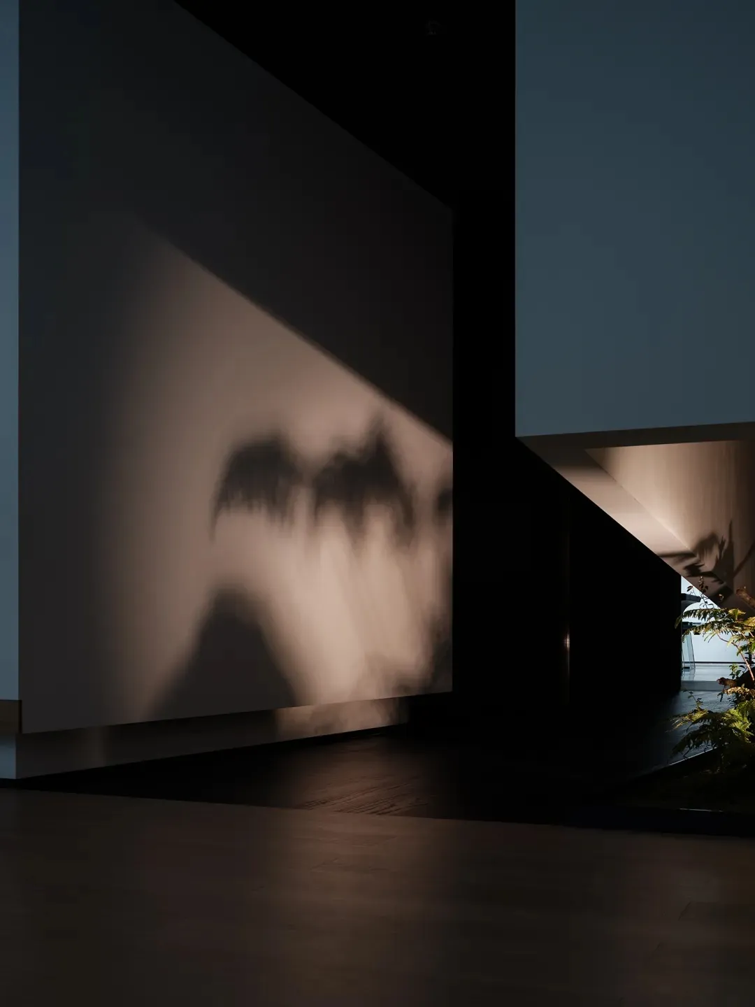 Concrete floor and wall with light fixture reflection