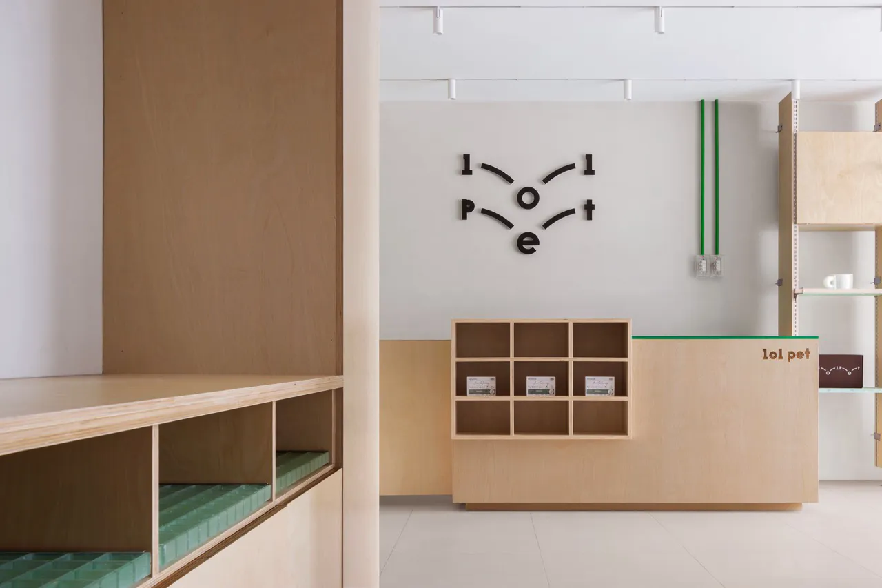 Modern spa interior featuring wooden furniture and white walls.