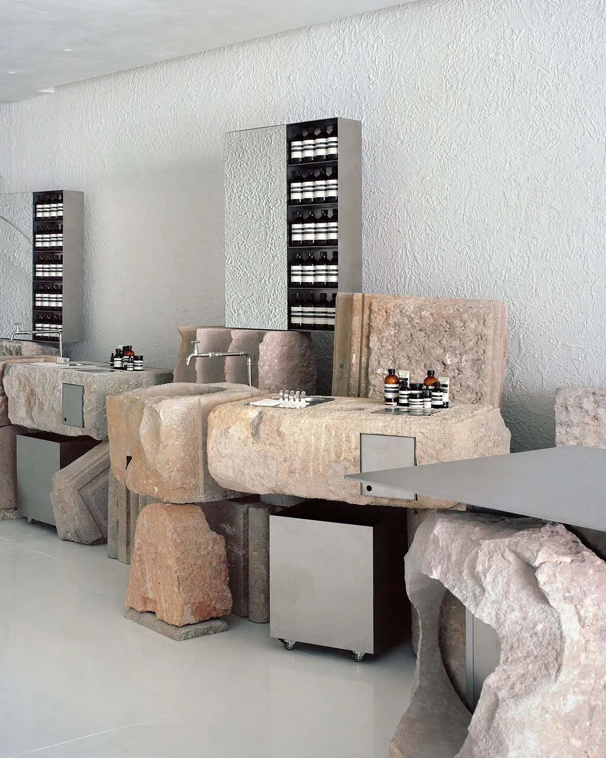 A spa interior featuring natural rock material, industrial design