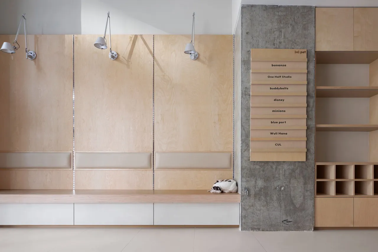 Modern minimalist living room with wooden walls, white marble floor, and concrete wall with wooden shelves.