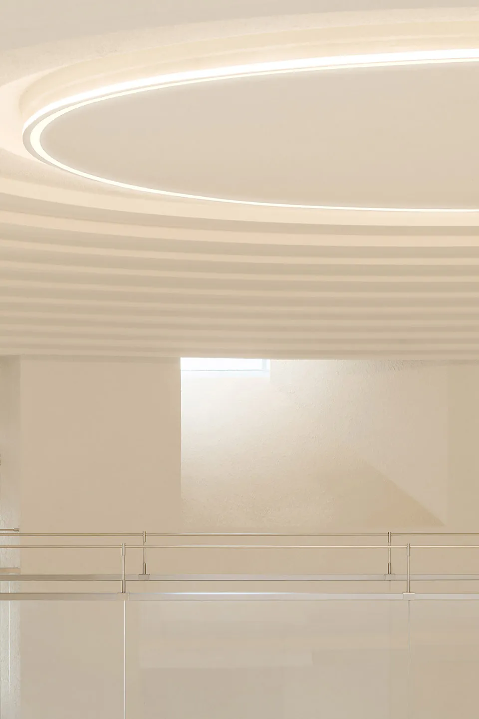 A modern interior space featuring glass ceiling for aesthetic and functional purposes in a contemporary design setting.