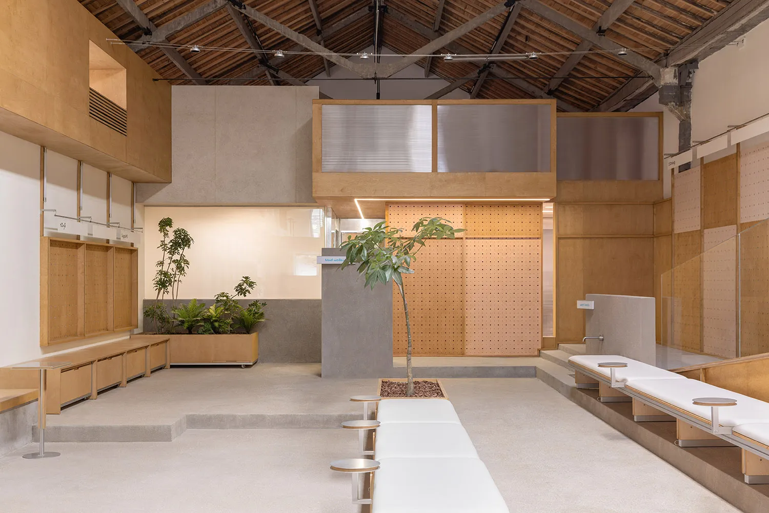 Industrial-style coffee shop with concrete floors and wooden elements