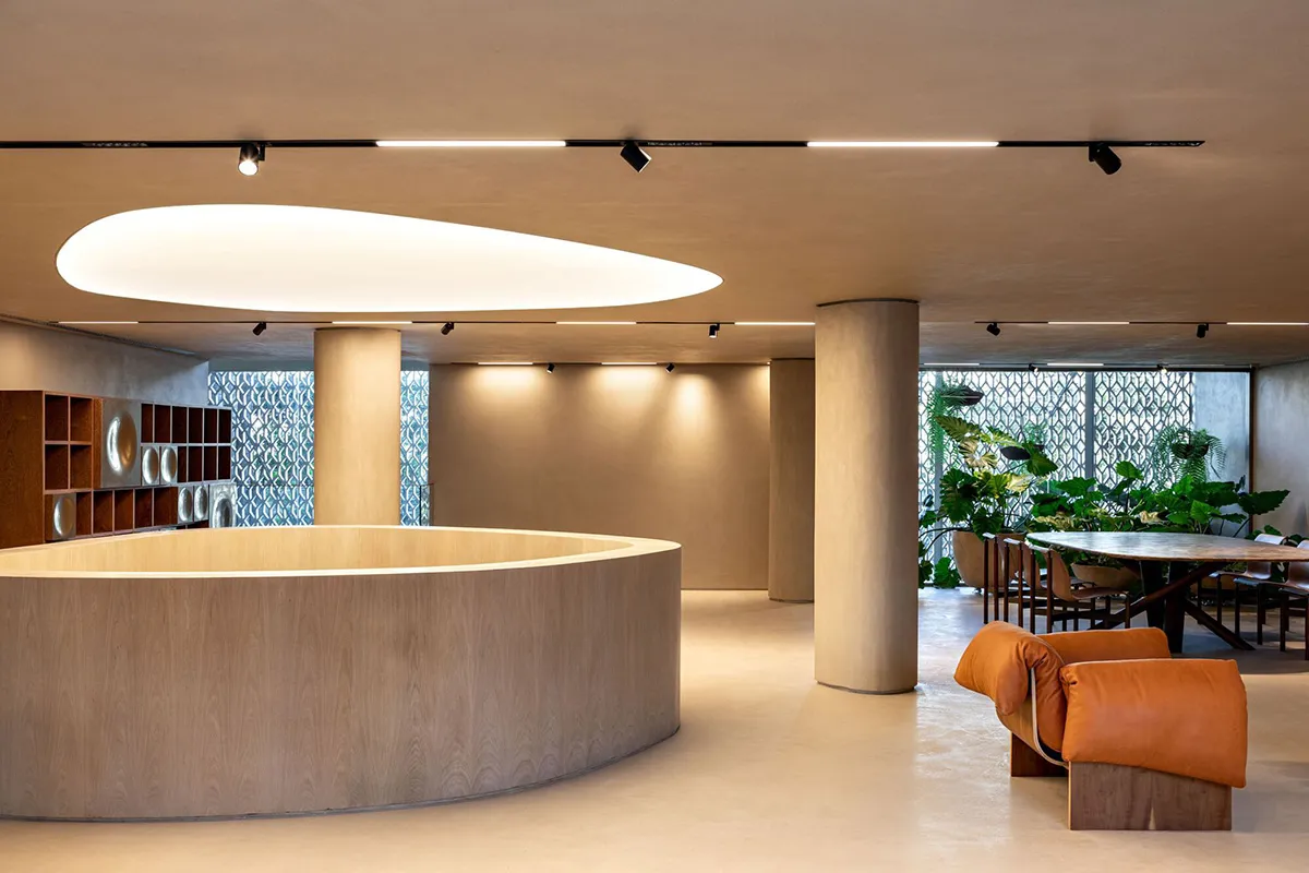 A modern, minimalist office space featuring wooden materials and contemporary design elements.