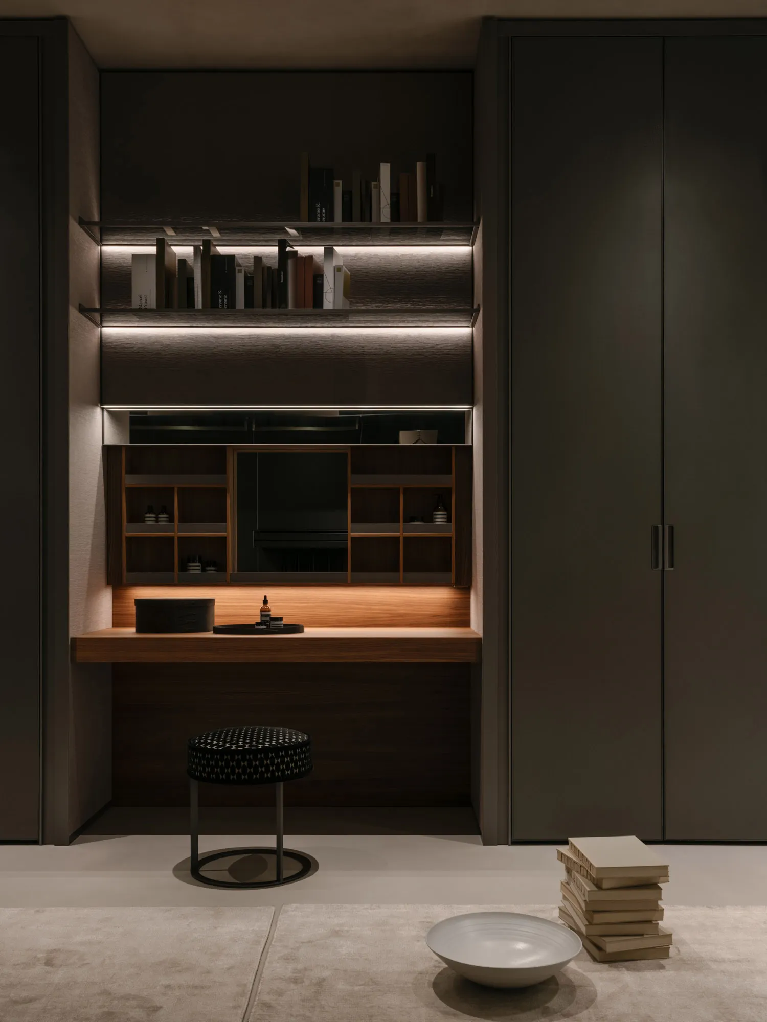 A modern home office with a wooden desk, glass shelves, and leather seating.