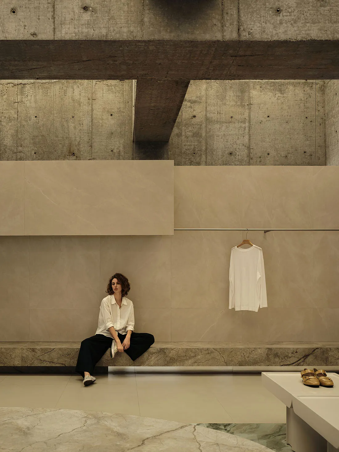 A modern retail storefront featuring minimalist concrete architecture and industrial style.