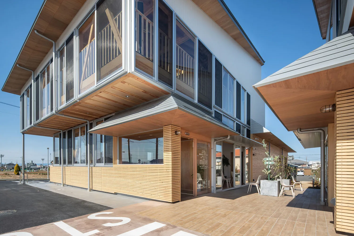 Modern building with metal-clad windows and balcony exterior.
