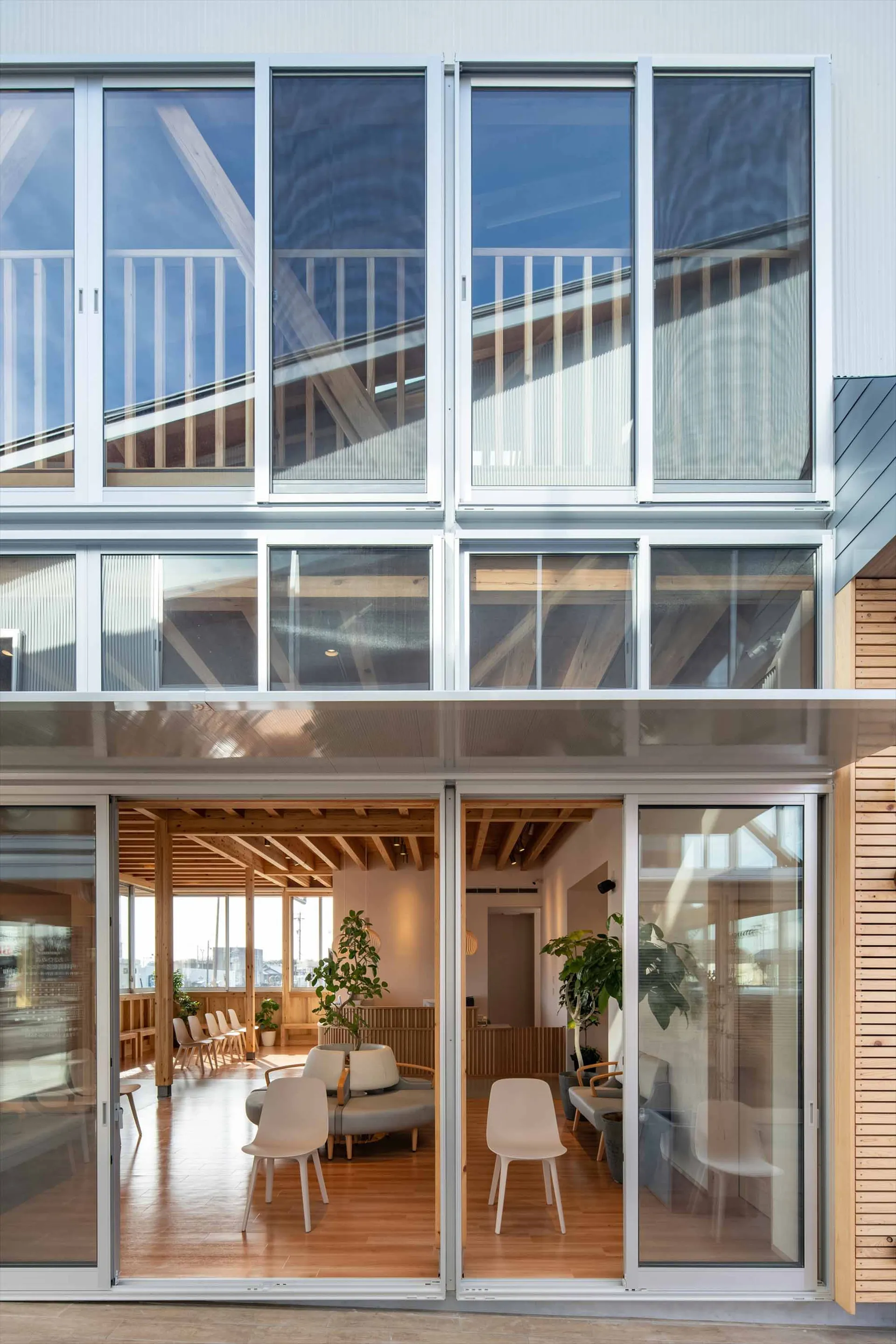 Modern office space featuring large windows with glass walls