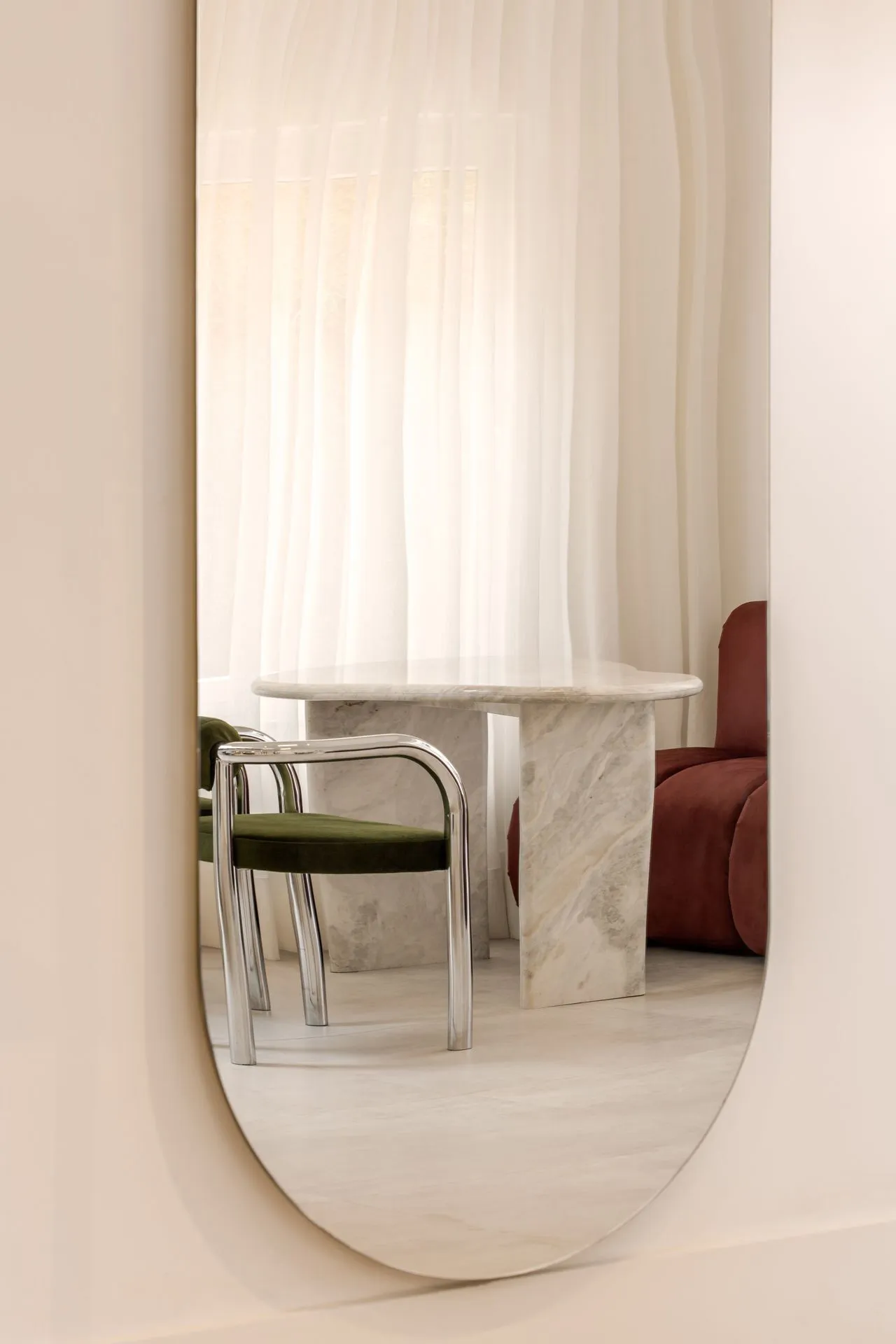 A modern marble table in a living room setting.