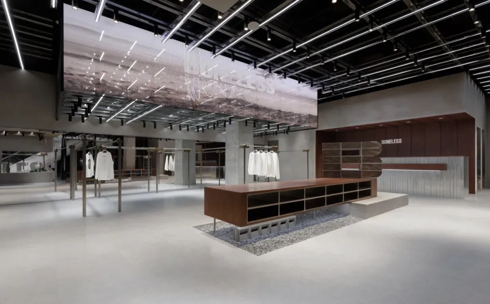 Modern retail storefront with concrete ceiling and minimalist design
