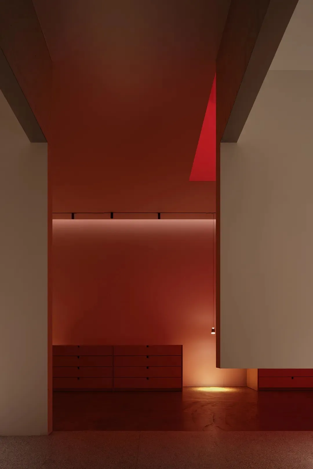 A modern interior space with concrete walls and flooring.