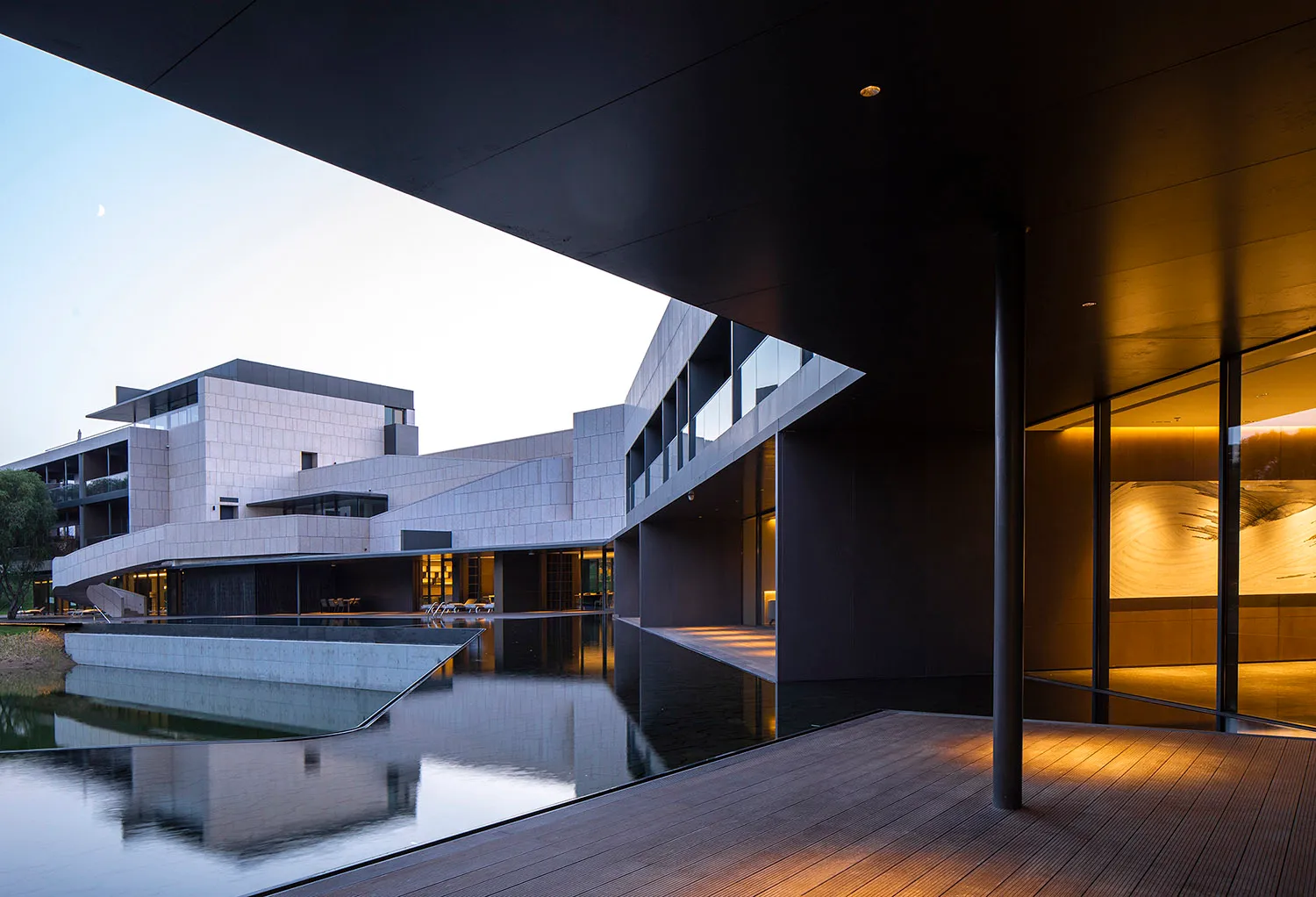 A modern building with glass and concrete exterior materials.