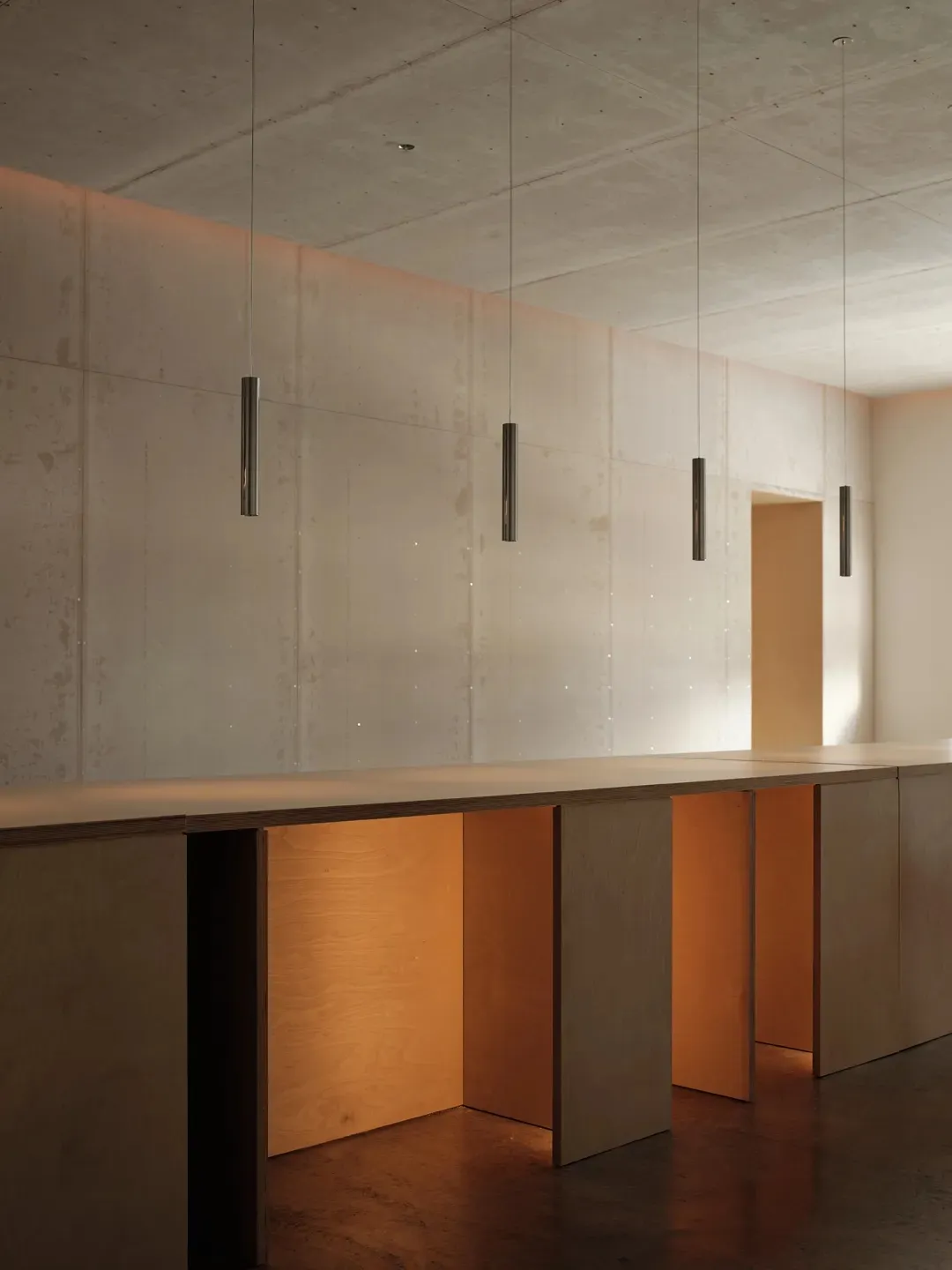 A modern office space with wood panels and a concrete ceiling.