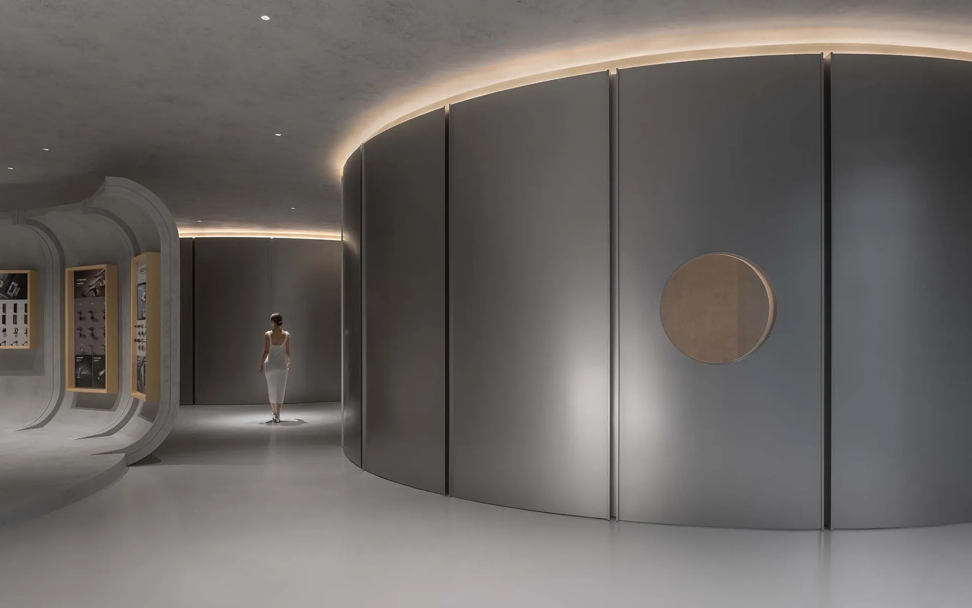 A minimalist commercial interior showcases sleek, modern features with concrete walls and flooring.