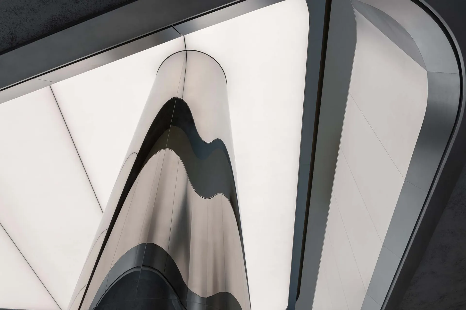 Metallic architectural facade with geometric lines and curves