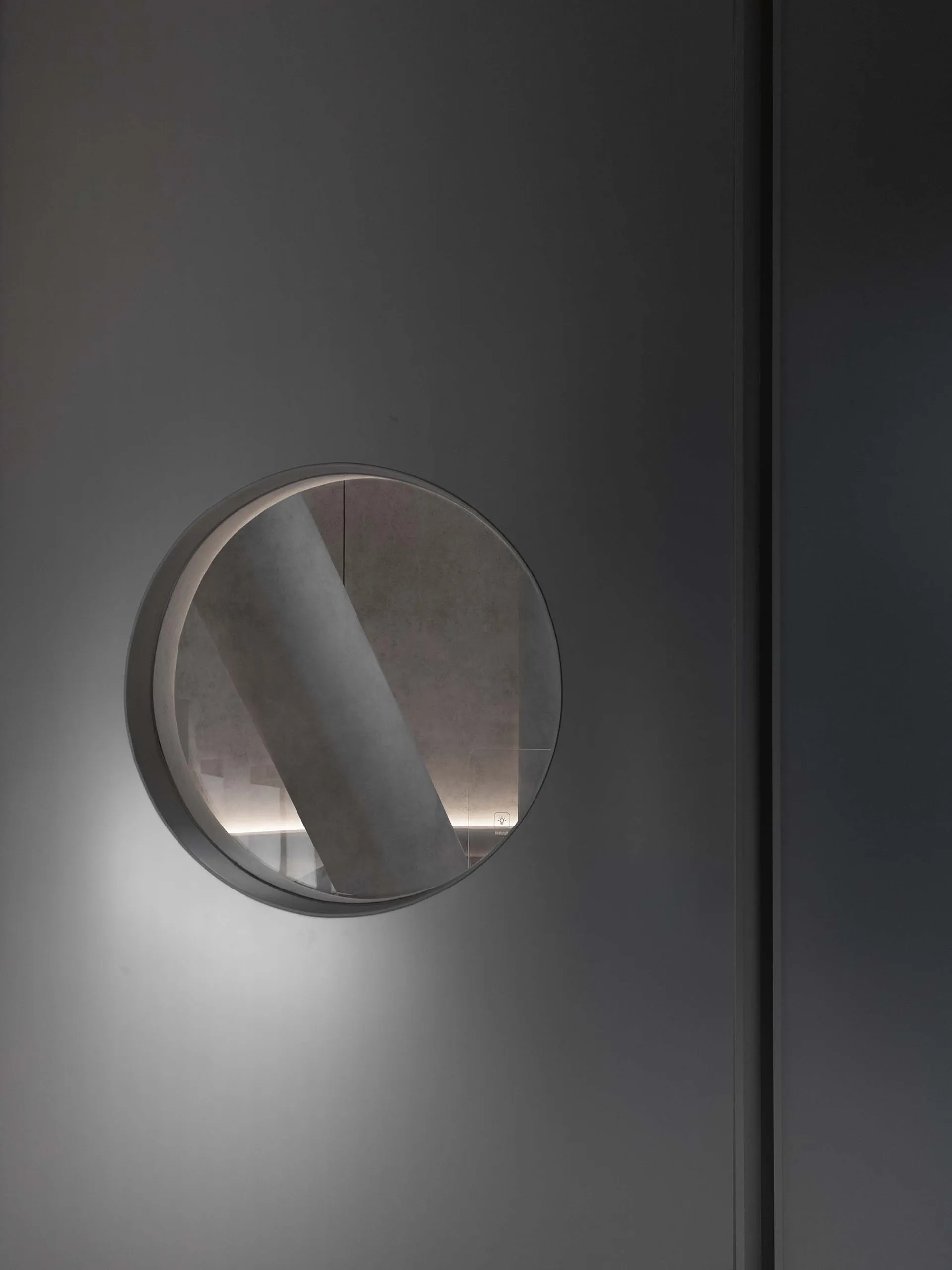 Modern interior design featuring contemporary lighting fixtures installed in glass wall panels.