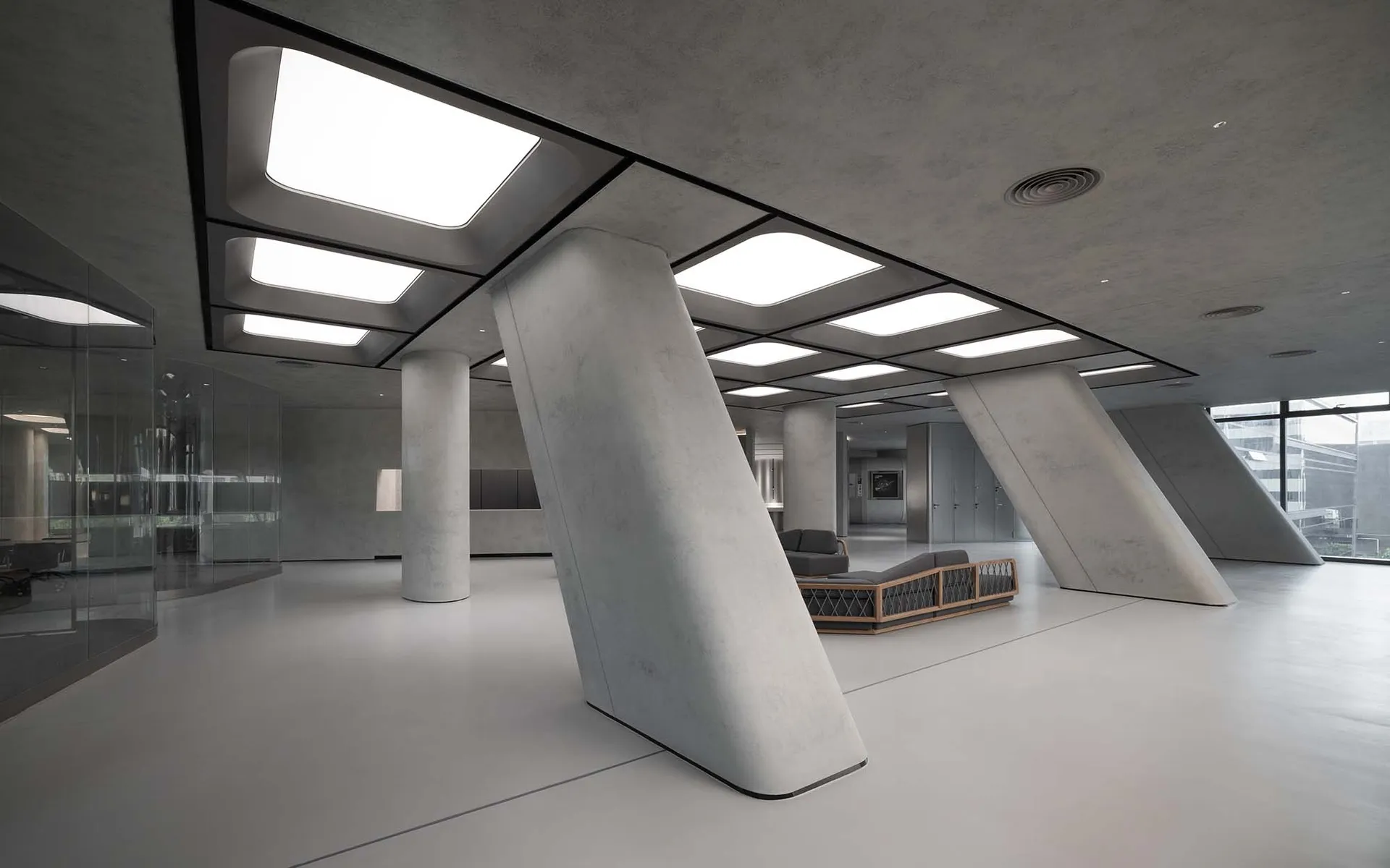 Modern office interior with concrete columns and white flooring.