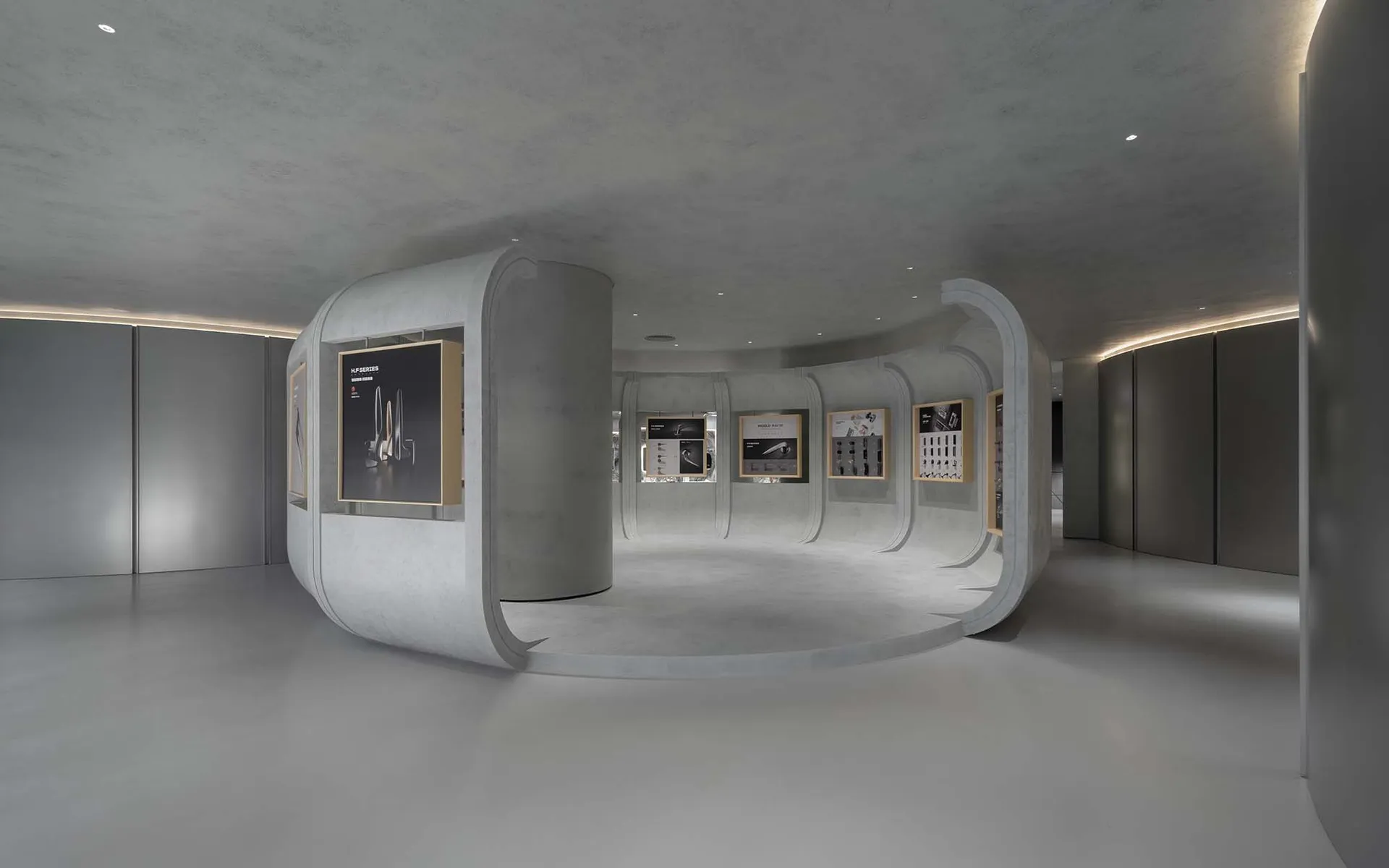 極簡展覽套房，採用混凝土牆面與地板，陳列多件藝術作品與資訊展示。