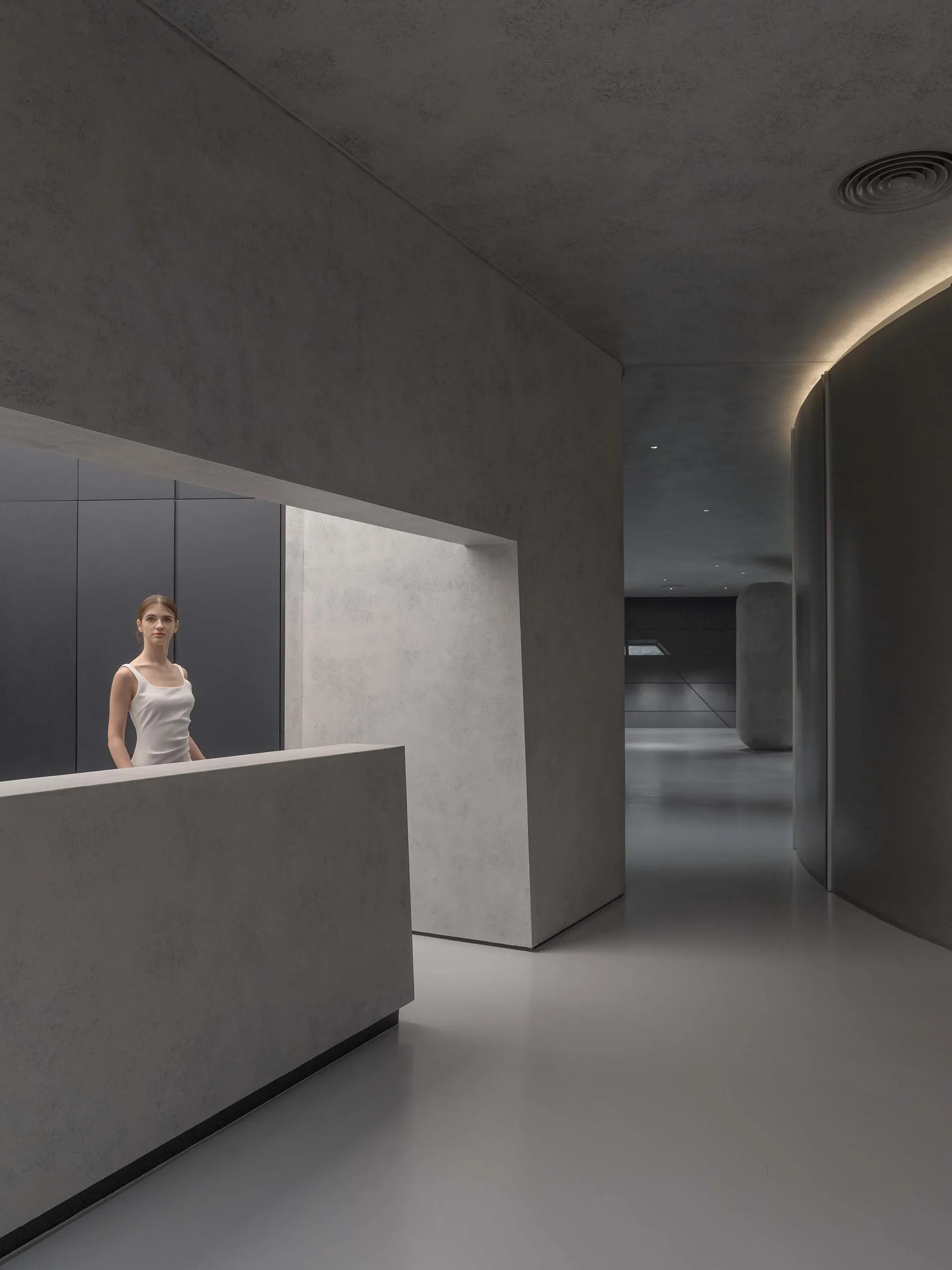 Modern hotel hallway with minimalist design and concrete materials