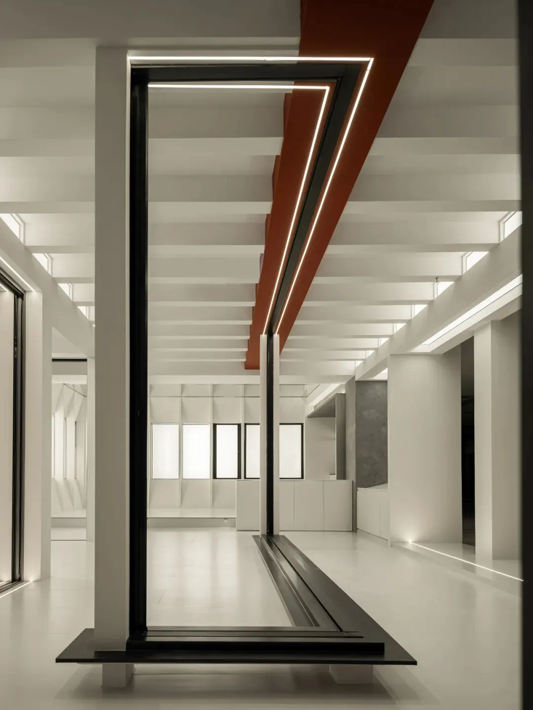 Modern lobby interior with concrete columns and lighting